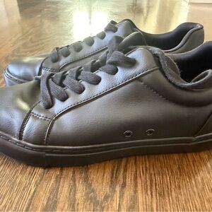 Women’s All-Black Low-Top Sneakers with Red Sole Accents